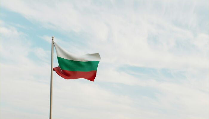 Flag of Bulgaria waving on a pole representing one of the bizarre facts about countries shared by 80 people.