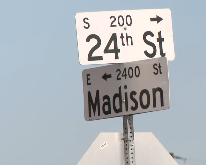 Street signs at the intersection of 24th Street and Madison Street near where police rescued 4 kids from a hot car. - 4