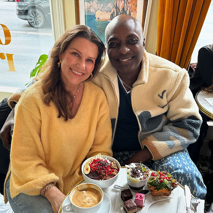 Couple enjoying a cozy café moment with desserts and coffee, reflecting love and life changes away from power.