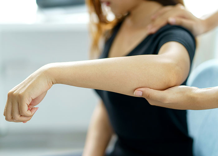 Private investigator examining a woman’s arm closely, discovering strange things during an investigation. - 25