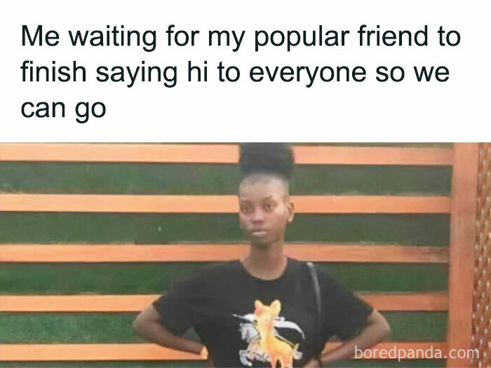 Young woman standing with hands on hips, waiting impatiently, funny memes reminding not to take life too seriously.