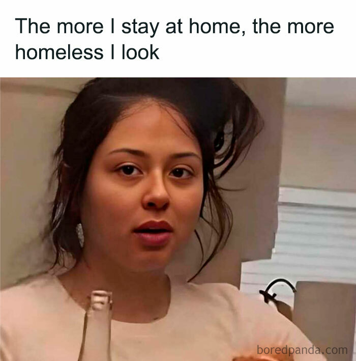 Woman with messy hair holding a bottle, illustrating funny memes reminding not to take life too seriously at home.