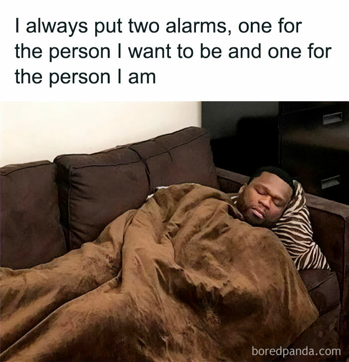 Man sleeping on a couch wrapped in a blanket with a funny meme about alarms, reflecting memes not to take life too seriously.
