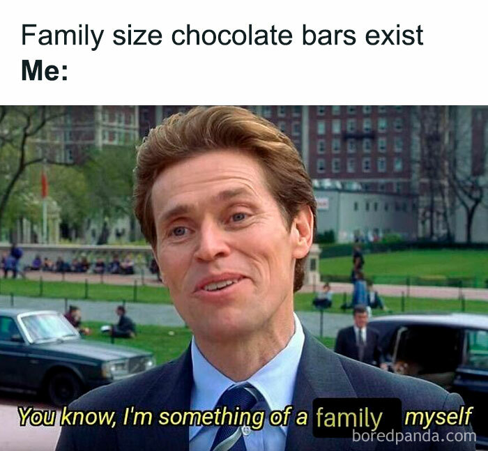 Willem Dafoe smiling in a suit with text about family size chocolate bars, a funny and random meme relatable to family.