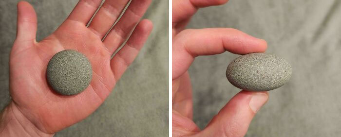 Smooth round stone held in hand, showing its unique shape and texture, a mildly interesting find shared online.