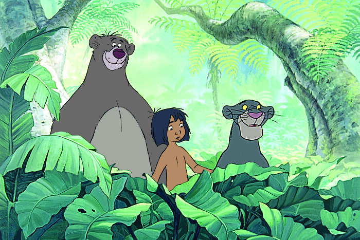 Characters from The Jungle Book in a lush jungle setting, featured in a Rate Disney Movies poll illustration.