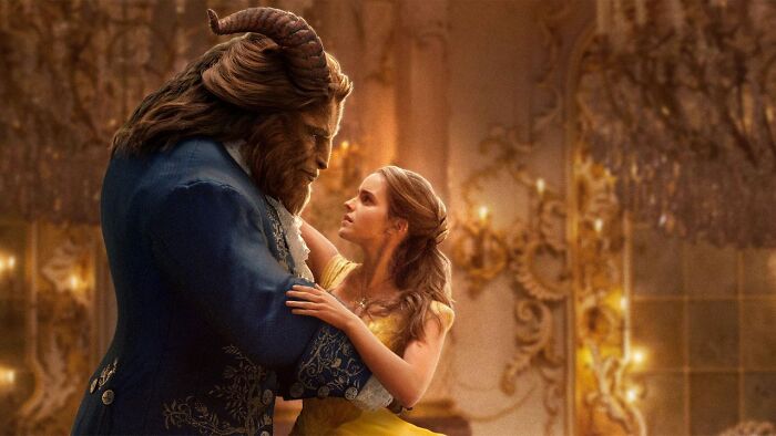 Beast and Belle dancing in a ballroom scene from a classic Disney movie for rate Disney movies poll.