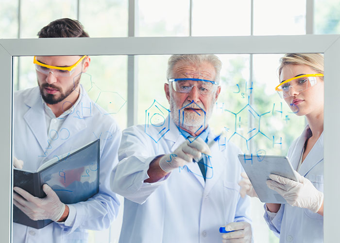 Scientists in a lab analyzing chemical formulas demonstrating seemingly harmless things that are actually dangerous risks.