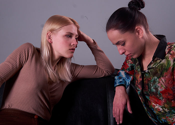 Two women engaged in a serious conversation highlighting seemingly harmless things that are actually very dangerous.