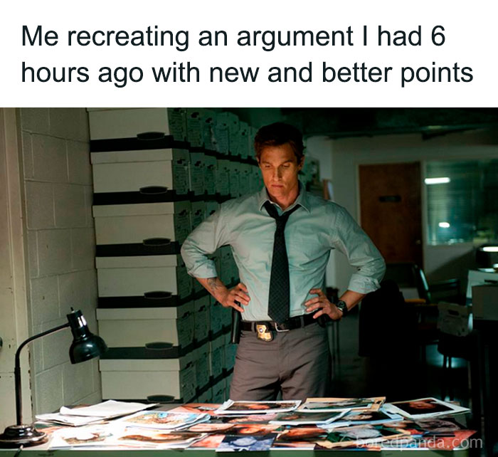 Man with hands on hips looking at papers, illustrating social anxiety memes about overthinking past arguments.