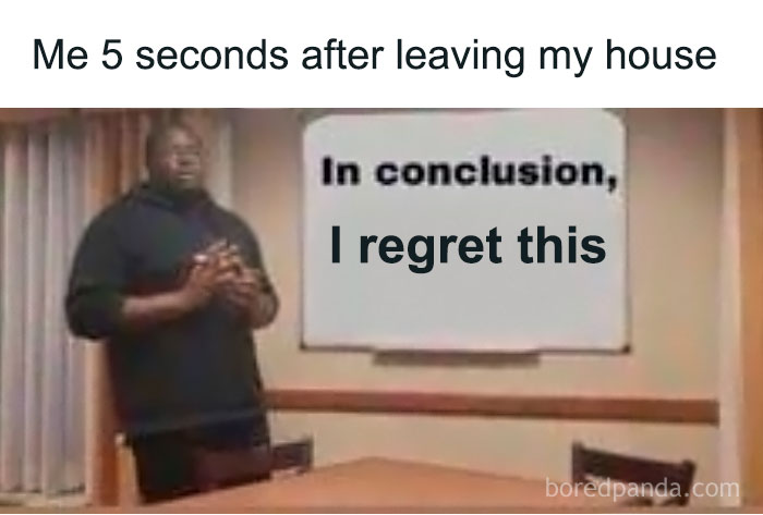 Man standing next to a presentation board with text expressing regret, illustrating social anxiety memes humor.