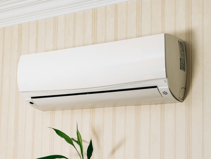 Smart air con mounted on wall, illustrating man gets revenge on late-night neighbor by turning it into a 3AM ice machine. - 5