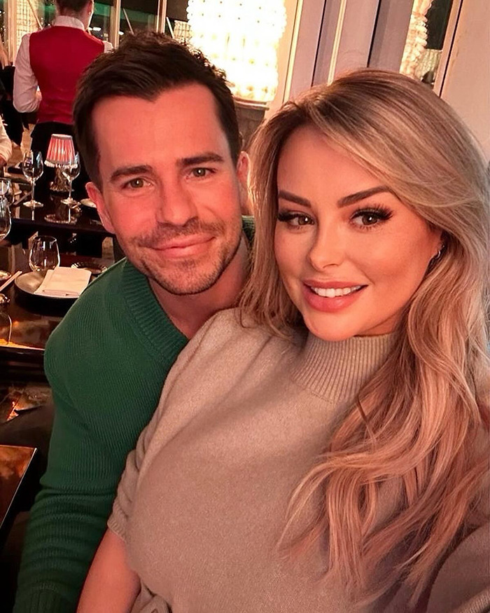 Rhian Sugden smiling with a man at a restaurant amid fan backlash over $13K plastic surgery and police involvement. Rhian Sugden smiling with a man at a restaurant amid fan backlash over $13K plastic surgery and police involvement.
