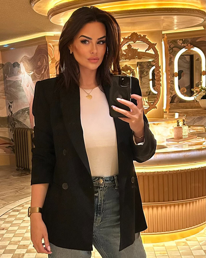 Rhian Sugden taking a mirror selfie in stylish outfit amid fan backlash over $13K plastic surgery controversy. Rhian Sugden taking a mirror selfie in stylish outfit amid fan backlash over $13K plastic surgery controversy.