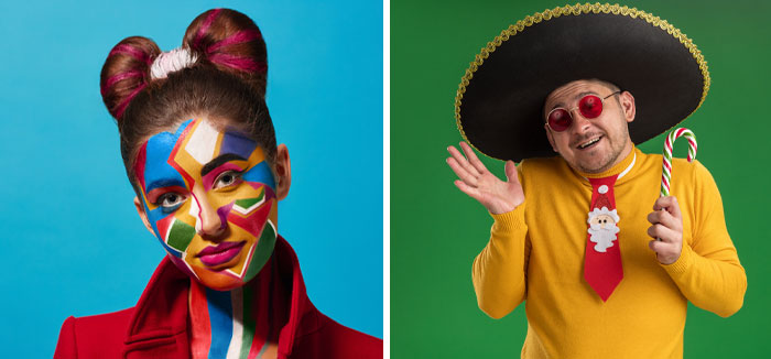 Two people in creative rhyme without reason costumes, one with colorful geometric face paint, the other in a festive sombrero.