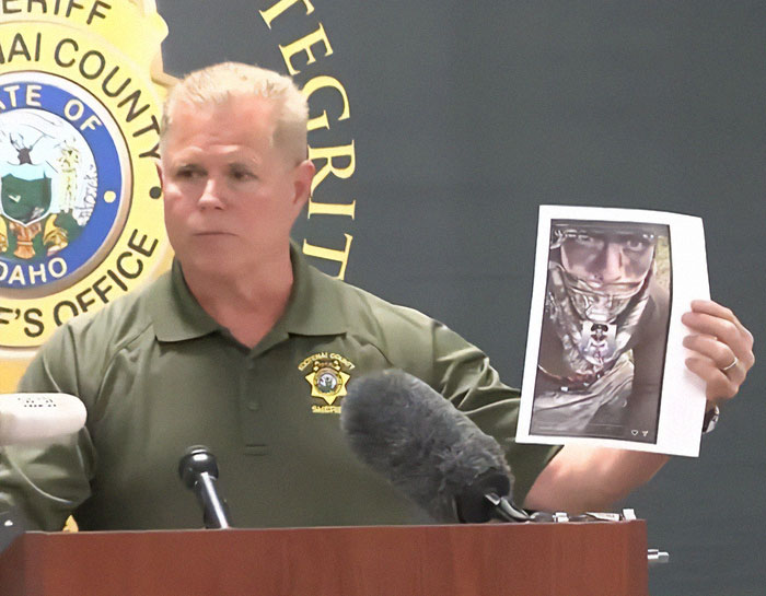 Owyhee County sheriff holding photo of Idaho teen sniper's ominous Instagram story before shooting firefighters.