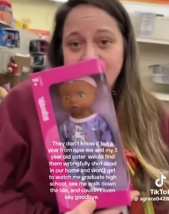 Young girl holding a doll, sharing a chilling eulogy that made cops suspect she killed her parents.