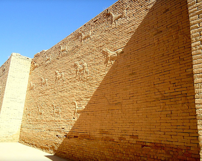 Ancient brick wall with carved figures under bright sunlight, related to deciphered 3,000-year-old text on women's roles. Ancient brick wall with carved figures under bright sunlight, related to deciphered 3,000-year-old text on women's roles.