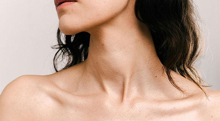 Close-up of a woman’s neck and shoulder area highlighting signs of serious medical conditions often dismissed and delayed diagnosis.