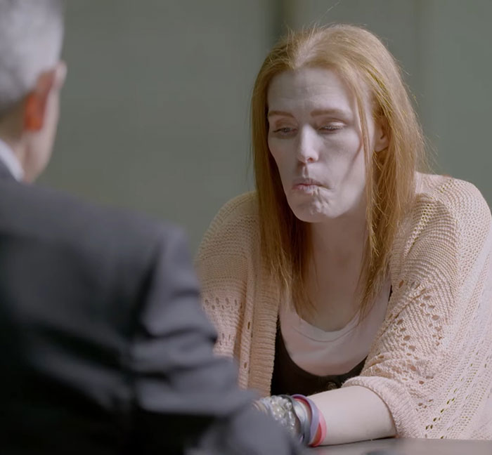 Shannon Price taking a lie detector test, looking tense while discussing Gary Coleman case with a man in a suit. Shannon Price taking a lie detector test, looking tense while discussing Gary Coleman case with a man in a suit.