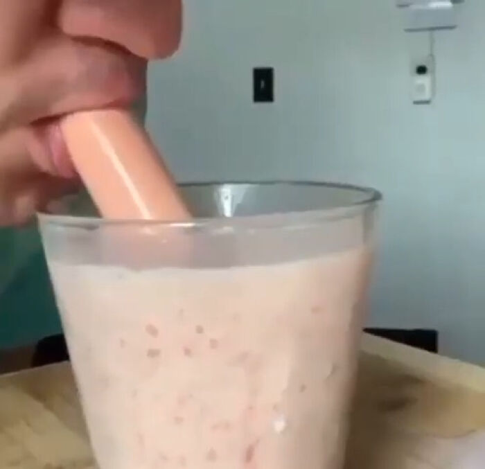 Person accidentally dipping a hot dog into a creamy drink illustrating mortifying sending stories. - 24