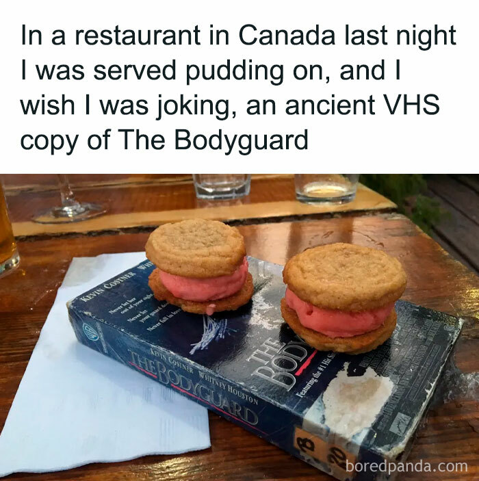 Pudding dessert served on an ancient VHS tape in a restaurant, showcasing one of the most unholy meal presentations possible.