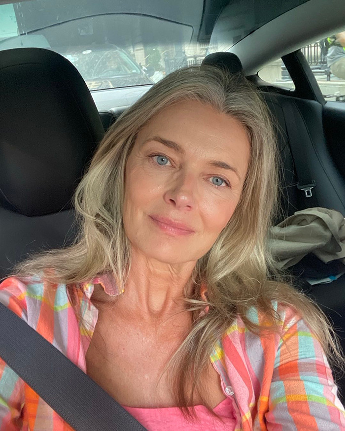 Supermodel 60 with natural look, no filters, sitting in a car wearing a colorful plaid shirt, showing authentic beauty. - 2