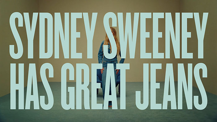 Sydney Sweeney sitting in a minimal room wearing jeans in an ad sparking woke scandal with ethnic cleansing accusations. - 4