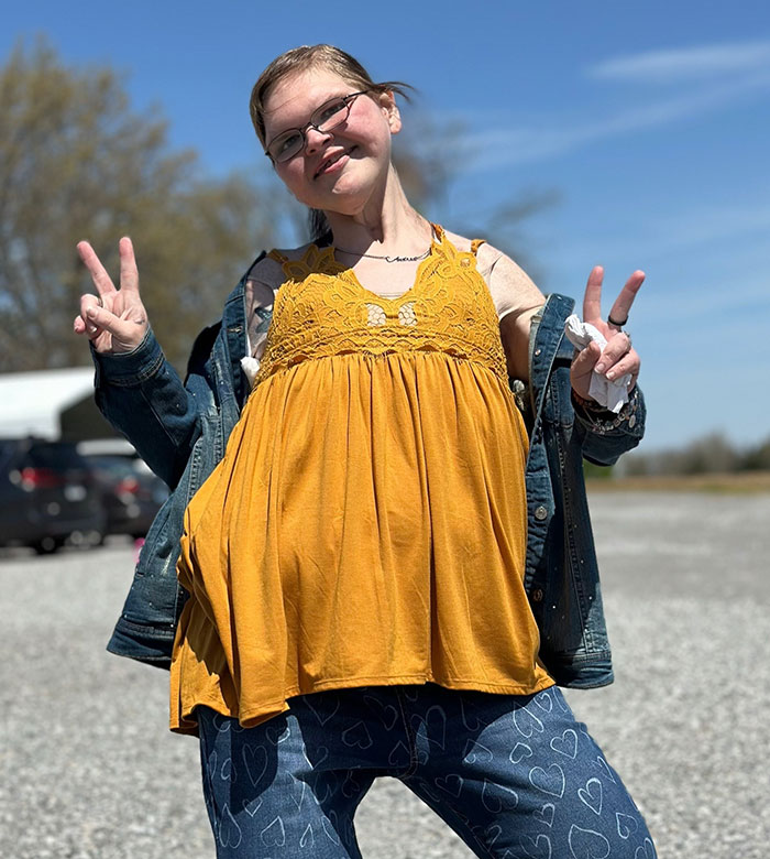 Tammy Slaton from 1000-Lb. Sisters posing outdoors, showing off results after skin removal surgery.