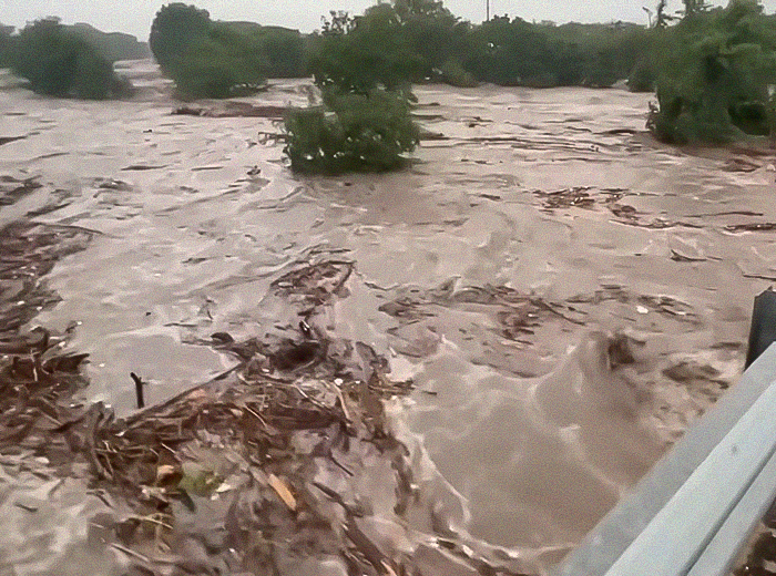 Raging floodwaters in Texas causing destruction as family of Travis Kelce's boss mourns young girl's loss.