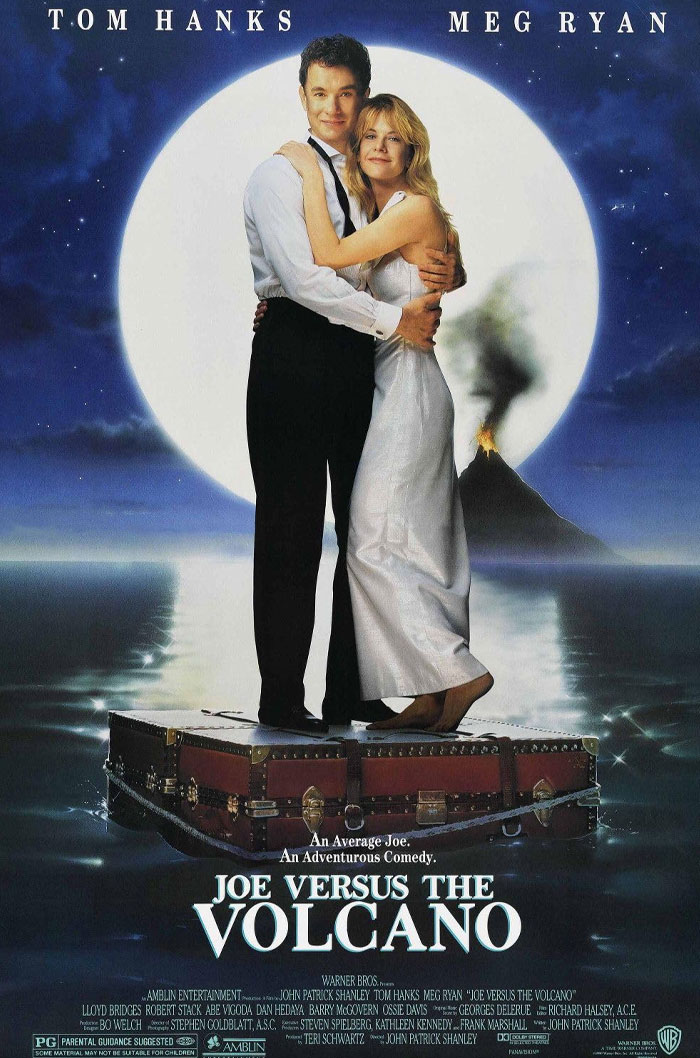Tom Hanks and Meg Ryan embracing on a raft with a volcano erupting in the background, highlighting underrated Tom Hanks movies.