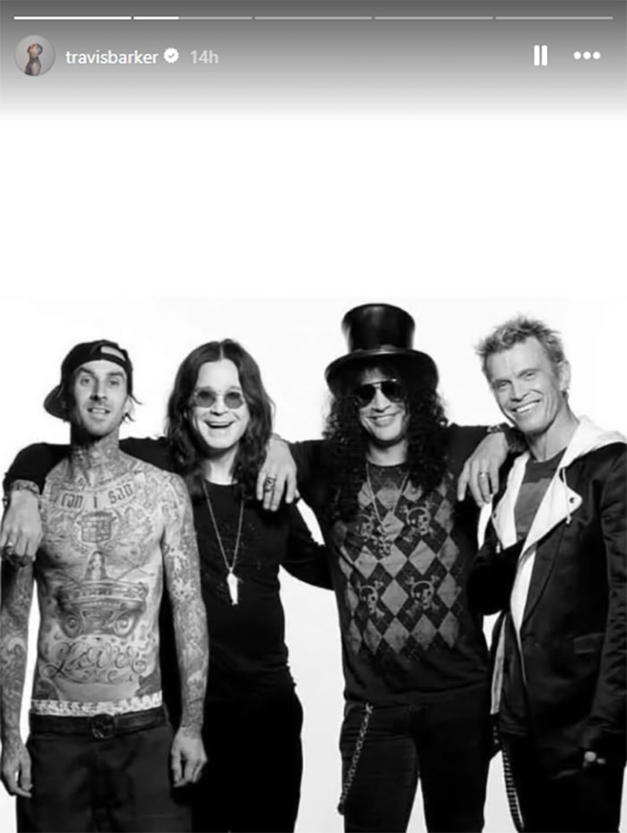 Black and white photo of rock legends including Ozzy Osbourne and Travis Barker posing together in tribute to the Prince of Darkness.