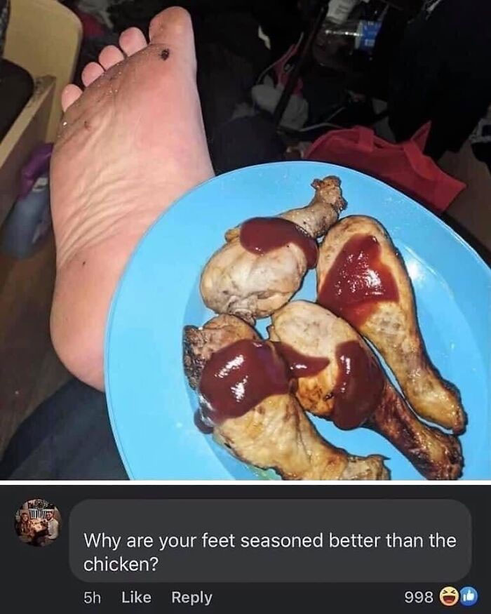 Cursed food image showing chicken drumsticks with barbecue sauce next to a foot in a casual indoor setting.