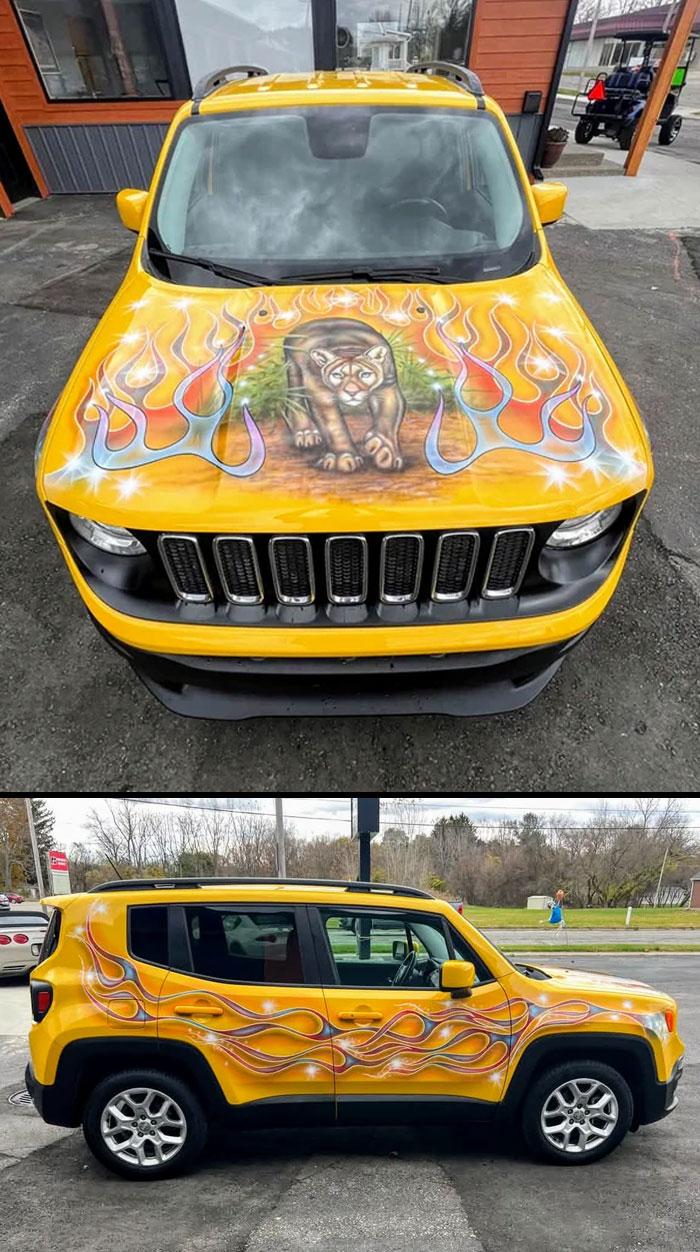 Yellow car with outrageous flame and cougar hood paint mod and matching side flames in a parking lot setting