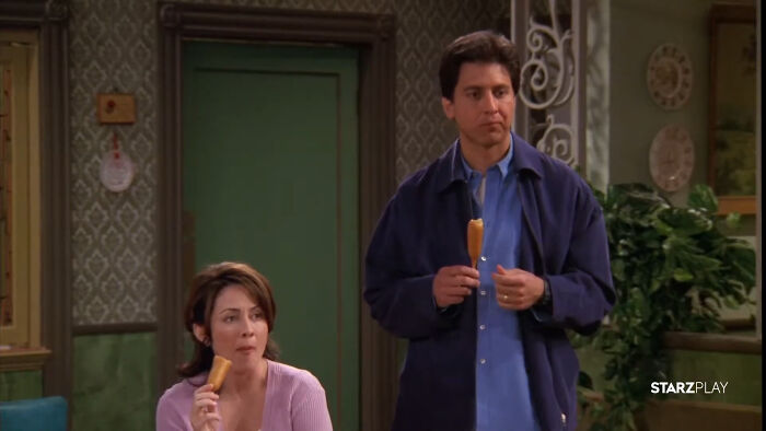 Two characters from a show eating corn dogs, representing shows with characters that are hard to love. - 15