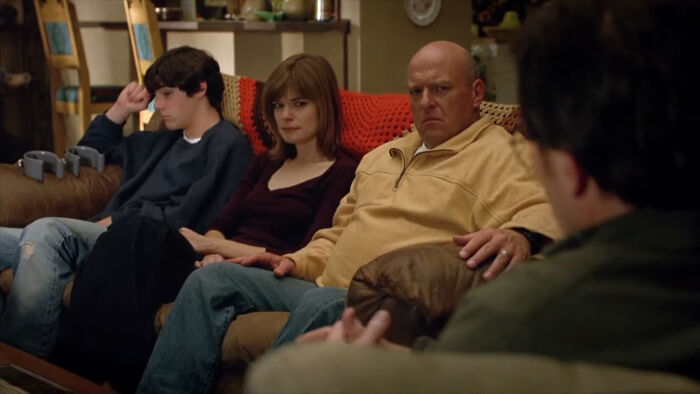A tense family scene from a TV show featuring characters that are very hard to love sitting on a couch. - 28