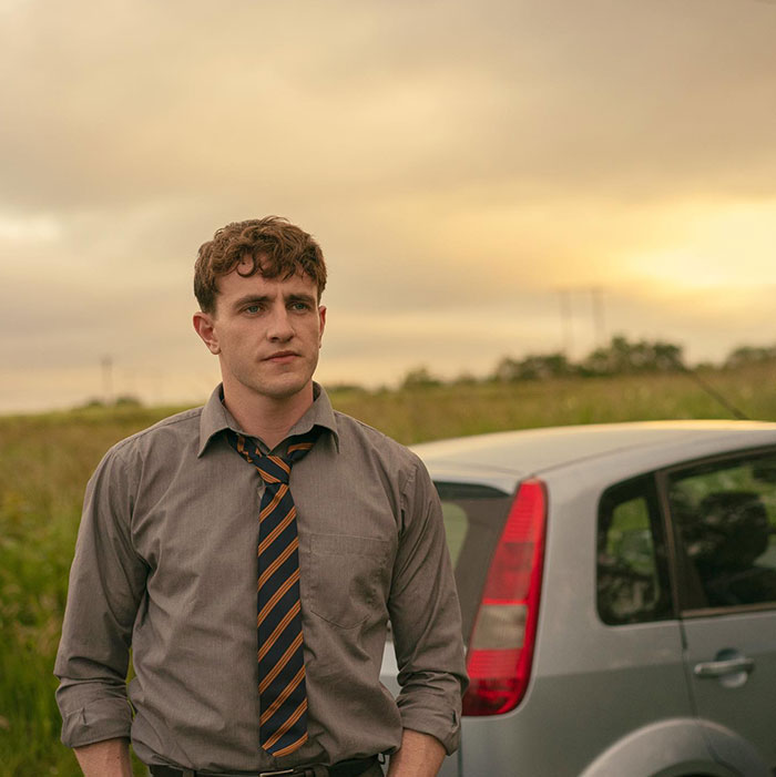Connell standing outdoors near a car at sunset, symbolizing rare boy names for stand-out babies.