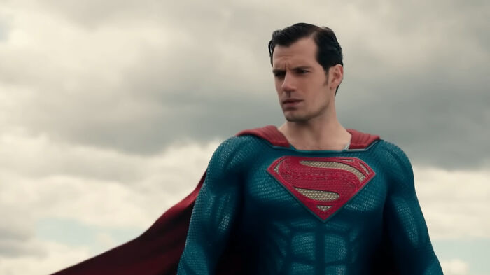 Actor Henry Cavill as Superman in a dramatic scene, representing celebrities that many people love but can't stand.