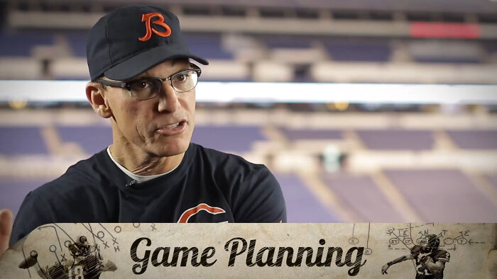 Teacher wearing a baseball cap and glasses sharing stories about truly outrageous student names in a classroom setting.