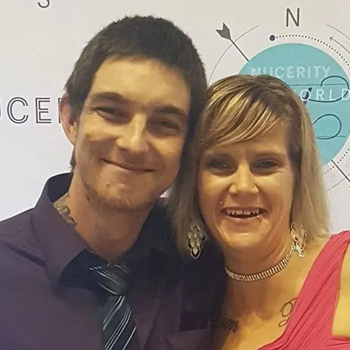 Smiling man and woman posing together, representing vigilante who punished and executed an innocent dad wrongly accused of assault. - 10