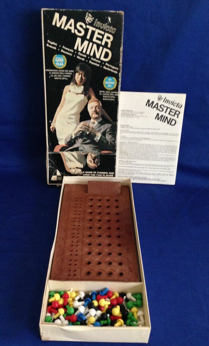 Vintage Mastermind board game with colorful pegs and original box, a classic vintage thing with nostalgic appeal