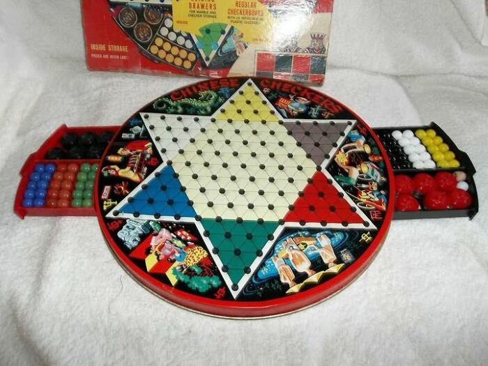 Vintage Chinese checkers game set with colorful marbles and detailed artwork, showcasing a classic 123 vintage item collection.
