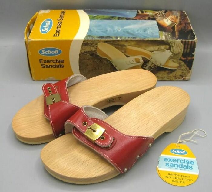 Vintage Scholl exercise sandals with wooden soles and red leather straps featuring brass buckles and original packaging.