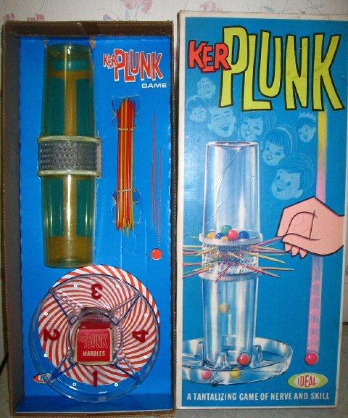 Vintage Ker Plunk game set with colorful marbles and sticks, showcasing unique and weird vintage collectible toys.