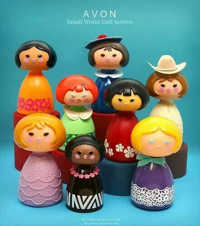 Set of colorful vintage Avon Small World Doll bottles, showcasing unique and wonderful vintage collectibles.