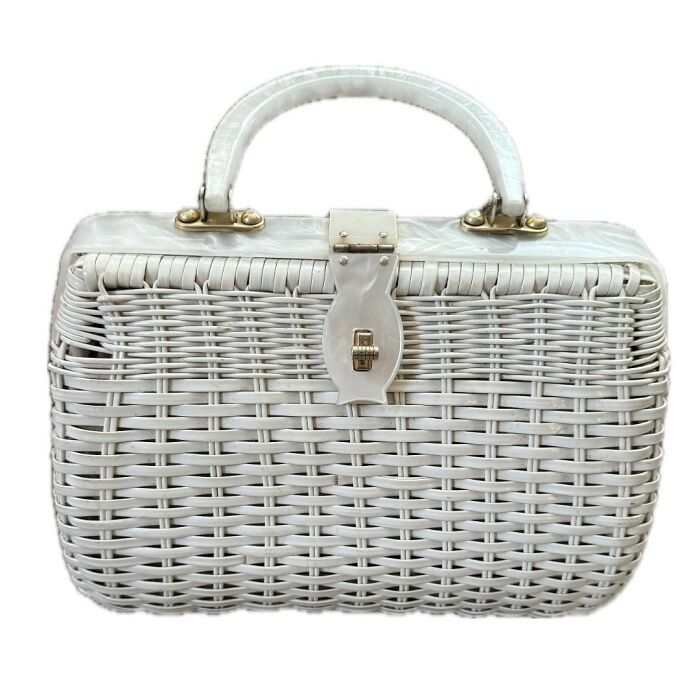 White vintage woven handbag with a clasp and handle, showcasing classic vintage things with unique design details.