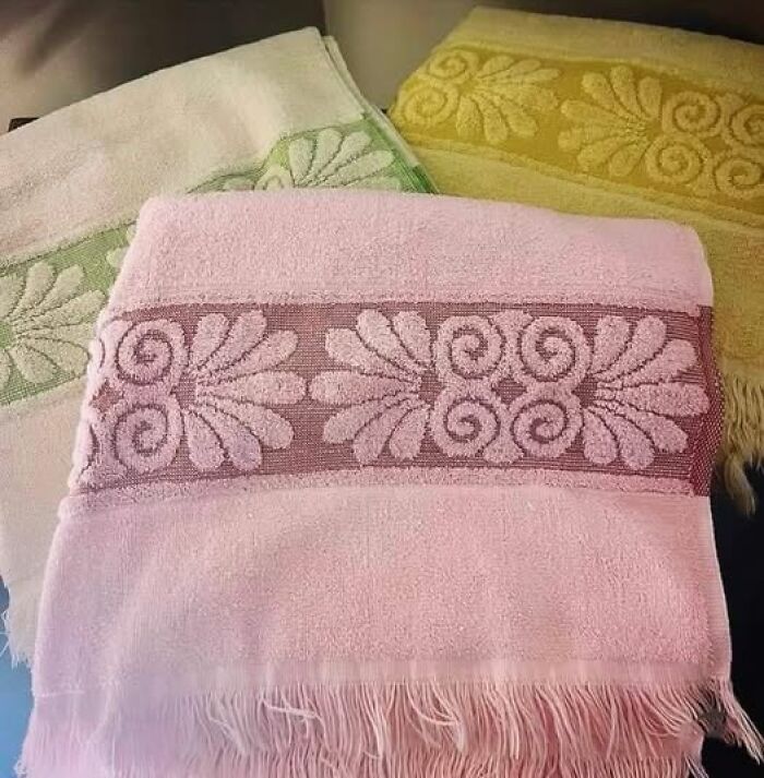 Vintage towels with intricate woven patterns and fringes, showcasing unique and charming vintage things design.