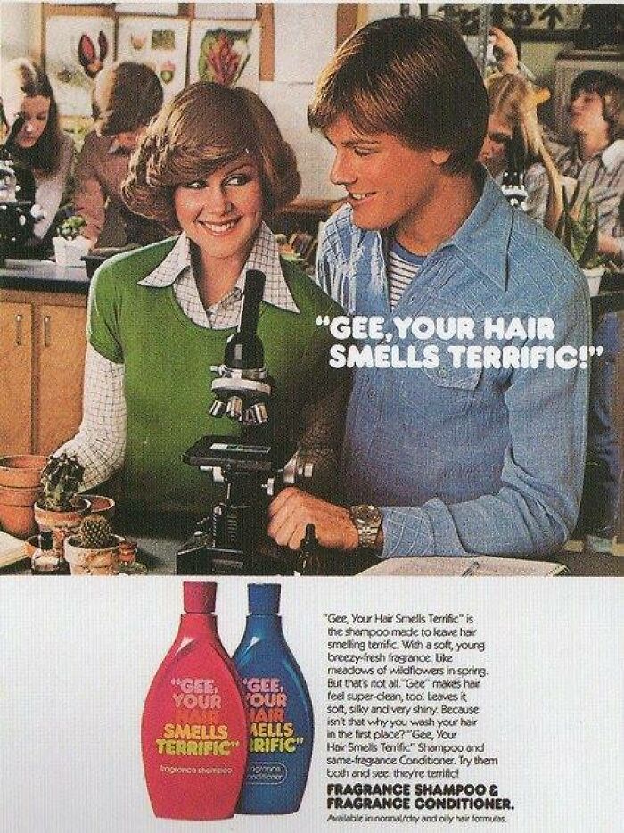 Vintage shampoo ad from the 1970s showing two teens with a microscope in a retro classroom setting.