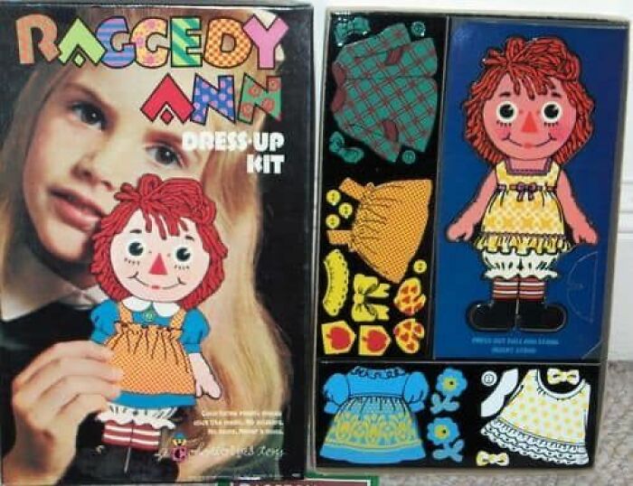 Vintage Raggedy Ann dress-up kit with paper doll and colorful clothing pieces from a vintage collection of weird and wonderful items.