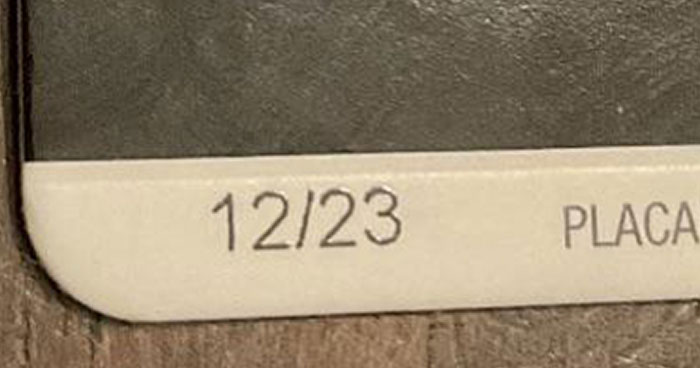 Close-up of a corner showing 12/23 on a school document, highlighting that not all schools are created equal.